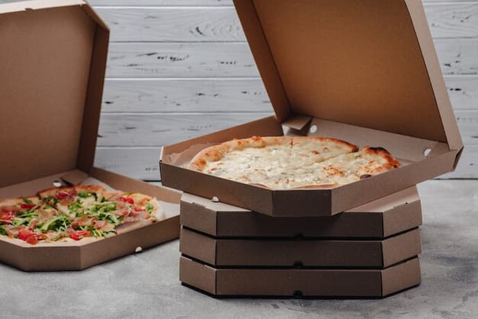 Quais fatores considerar ao selecionar um fabricante de caixas de pizza?